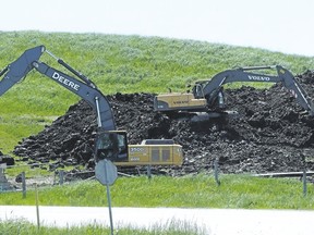 Crews with backhoes work on a methane collection system at the Petrolia landfill in this file photo. (File photo/Postmedia Network)
