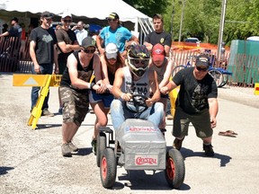Kyle Liedtke, of The 80 Percenters, had the relatively easy job of steering while his teammates, Adam Thompson (left), Rebecca White, Katelyn Stairs, Maggie Thompson and Shawn Rose propelled him forward during the Redneck Games’ homemade truck race in Kyle Liedtke, of The 80 Percenters, had the relatively easy job of steering while his teammates, Adam Thompson (left), Rebecca White, Katelyn Stairs, Maggie Thompson and Shawn Rose propelled him forward during the Redneck Games’ homemade truck race in Mitchell Lions Park this past Saturday, June 11. The 80 Percenters went on to win the Redneck Games, after which they donated their winnings back to the Mitchell and District Agricultural Society. GALEN SIMMONS MITCHELL ADVOCATE
