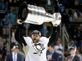 Phil Kessel of the Pittsburgh Penguins celebrates with the Stanley Cup after their 3-1 victory over the San Jose Sharks in Game 6 of the 2016 Stanley Cup final in San Jose, Calif., on Sunday, June 12, 2016. (Christian Petersen/Getty Images/AFP)
