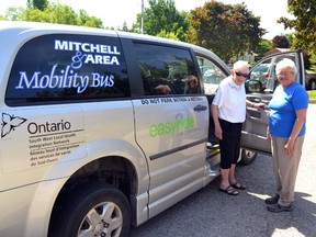With the help of Mitchell and area Mobility Van driver Martha Sykes, Sheila Farqhuar (left) boards the van before heading over to the West Perth Public Library in Mitchell where she volunteers for a few hours every week. Without the Mitchell and Area Mobility Bus program, finding rides to and from the library every week would be more difficult on Farqhuar, a long-time client and a member of the mobility bus committee. GALEN SIMMONS MITCHELL ADVOCATE