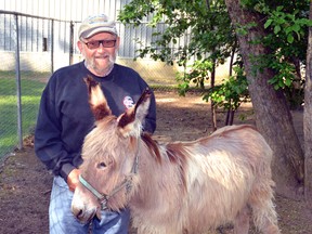 Lions Park Animal Caretaker Bill French is happy to show off the newest addition to the park, Francis Too. GALEN SIMMONS MITCHELL ADVOCATE