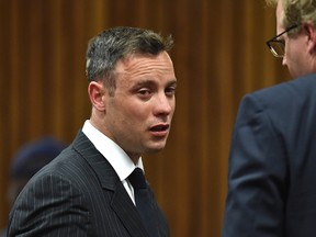 Oscar Pistorius cries as he appears in the High Court for re-sentencing proceedings, in Pretoria, South Africa, on Monday, June 13, 2016. Pistorius appeared for a sentencing hearing after the double-amputee Olympian was convicted of murdering girlfriend Reeva Steenkamp. Defence lawyer Barry Roux argued for some leniency and called a psychologist who evaluated Pistorius to testify. (Phill Magakoe/Pool Photo via AP)