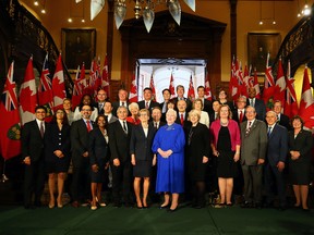 Premier Kathleen Wynne and Lt.-Gov. Elizabeth Dowdeswell pose with the entire Ontario cabinet announced on June 13, 2016. (Dave Abel/Toronto Sun)