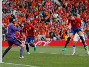 Spain's Gerard Pique scores the opening goal during the Euro 2016 Group D soccer match between Spain and the Czech Republic at the Stadium municipal in Toulouse, France, Monday, June 13, 2016. (Manu Fernandez/AP Photo)