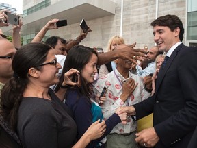 Prime Minister Justin Trudeau interacts with the public at the Women's College Hospital after the ribbon cutting opening ceremony, in Toronto, on Friday, June 10, 2016. THE CANADIAN PRESS/Eduardo Lima.
