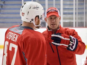 Scott Jones, right, instructs Hershey Bears winger Liam O'Brien during the Washington Capitals' 2015 development camp. Jones, co-owner of Total Package Hockey, a skills development consultant for the Capitals' prospects, launched a high performance academy in Sarnia this past season. (Handout/Sarnia Observer/Postmedia Network)