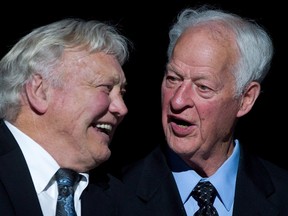 Bobby Hull, left, and Gordie Howe joke around during an 85th birthday ceremony in March 2013. (THE CANADIAN PRESS/Darryl Dyck file photo)
