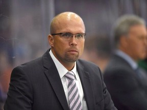 Minnesota Wild head coach Mike Yeo looks on as his team takes on the Edmonton Oilers during the first period of an NHL pre-season hockey game in Saskatoon, Sask., on Saturday, September 26, 2015. A dramatic midseason slump for the third straight year and a poor outing Saturday to extend Minnesota's home winless streak led Wild general manager Chuck Fletcher to fire Yeo. THE CANADIAN PRESS/Liam Richards