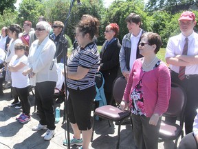 Members of Circle of Friends, a volunteer-run group of people with developmental disabilities who have formed a performing ensemble, sing at a memorial service at Ongwanada in Kingston. (Michael Lea/The Whig-Standard)