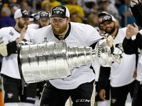Phil Kessel of the Pittsburgh Penguins celebrates with the Stanley Cup after their 3-1 victory to win the Stanley Cup against the San Jose Sharks in Game 6 of the Stanley Cup final at SAP Center in San Jose on June 12, 2016. (Christian Petersen/Getty Images/AFP)