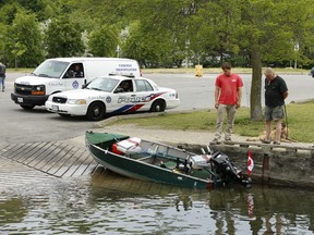 A recovered aluminum boat sits in a slip at Bluffer's Park on Monday (JACK BOLAND, Toronto Sun)