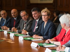 Ontario Premier Kathleen Wynne holds the first cabinet meeting after the announcement of a cabinet shuffle at Queen's Park on  June 13. (THE CANADIAN PRESS)