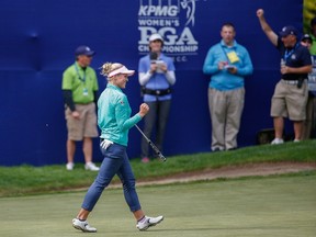 Brooke Henderson of Canada reacts after making a putt on the 17th hole during the final round of the KPMG Women's PGA Championship at Sahalee Country Club in Sammamish, Wash., on June 12, 2016. (Otto Greule Jr/Getty Images/AFP)