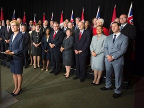 Ontario Premier Kathleen Wynne speaks to the media after the first meeting with her new cabinet following their swearing in at Queen's Park in Toronto on Monday, June 13, 2016. (THE CANADIAN PRESS/Peter Power)