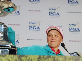 Brooke Henderson of Canada poses with the trophy after winning the KPMG Women's PGA Championship at the Sahalee Country Club in Sammamish, Wash., on June 12, 2016. (Scott Halleran/Getty Images for KPMG/AFP)