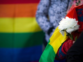 A large group gathered at the Human Rights monument on Elgin Street on Sunday, June 12, 2016, to show support for the mass shooting in Orlando at Pulse, a gay nightclub.