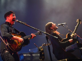 Marcus Mumford and Winston Marshall from Mumford and Sons perform at Canadian Tire Centre during the Wilder Mind tour on Sunday, June 12, 2016. (James Park)