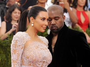 In this May 4, 2015, file photo, Kim Kardashian, left, and Kanye West arrive at The Metropolitan Museum of Art's Costume Institute benefit gala in New York. (Photo by Charles Sykes/Invision/AP, File)