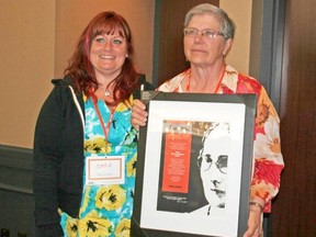 Sarah LaBelle of the Ontario NDP Women's Caucus awards Fran McQuail the Agnes MacPhail Award for her role as a mentor and advocate for women. Fran McQuail is the first recipient of this award from Huron-Bruce. (Willi Laurie/Huron-Bruce NDP)