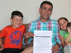 Syrian refugees Muhammad Othman (centre), his three children, Sipan (left), Sevine (right) and Sibar (far right) and his wife (not pictured) are facing a possible eviction from their apartment because their downstairs neighbour says they make too much noise. Photo shot in London, Ont. on Friday June 10, 2016. (Azurra Lalani/Postmedia Network)