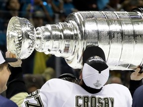 Sidney Crosby of the Pittsburgh Penguins kisses the Stanley Cup after their win over the San Jose Sharks in Game 6 of the final at SAP Center on June 12, 2016 in San Jose. (Robert Reiners/Getty Images/AFP)