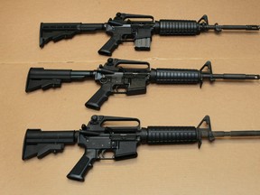 In this Aug. 15, 2012 file photo, three variations of the AR-15 assault rifle are displayed at the California Department of Justice in Sacramento, Calif. (AP Photo/Rich Pedroncelli,file)