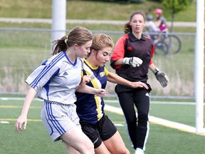 Gino Donato/Sudbury Star
Hannah Gascon of Scare Coeur and McKenna Cresswell of Bishop Alexander Carter battle for the ball during girls high school division 2 city championship soccer action in Sudbury on Monday.