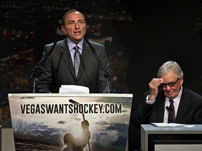 In this Feb. 10, 2015, file photo, NHL commissioner Gary Bettman addresses the crowd as Bill Foley wipes his forehead during the “Let’s Bring Hockey to Las Vegas!” press conference at the MGM Grand Ballroom in Las Vegas. (AP Photo/The Sun, L.E. Baskow, File)