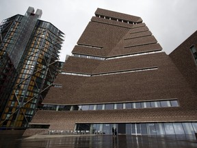 An exterior view of a new building called the Switch House which has been added on to the Tate Modern gallery in London, Tuesday, June 14, 2016. The gallery has undergone a major refurbishment with the construction of the Switch House on the side, increasing the overall size of the space by 60%. (AP Photo/Matt Dunham)