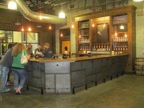 Visitors sample whiskey at the bar in Nelson's Green Brier Distillery in Nashville, Tennessee. 
(SARAH DOKTOR/Postmedia Network)