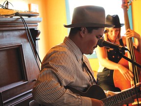 Blue Moon Marquee’s A.W. Cardinal strums his guitar while Jasmine Colette provides the bass line. Raw stories and nostalgic sound truly give Blue Moon Marquee a timeless feel. | Carlos Verde photo/Pincher Creek Echo