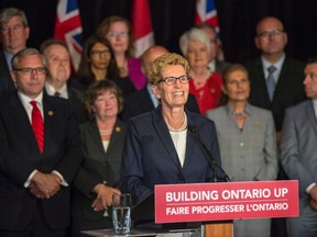 Premier Kathleen Wynne talks to media at her first press conference after the announcement of a cabinet shuffle at Queen's Park in Toronto, on Monday, June 13, 2016. (THE CANADIAN PRESS/Eduardo Lima)