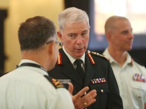 Lt.-Gen. Guy Thibault, vice chief of the defence staff for the Canadian Armed Forces, talks with army officers after delivering the keynote address at the 11th annual Kingston Conference of International Security on Tuesday, June 14, 2016 in Kingston, Ont. Elliot Ferguson/The Whig-Standard/Postmedia Network