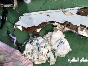 This picture posted Saturday, May 21, 2016, on the official Facebook page of the Egyptian Armed Forces spokesman shows part of the wreckage from EgyptAir flight 804. Human remains retrieved from the crash site of EgyptAir Flight 804 suggest there was an explosion on board that may have brought down the aircraft in the east Mediterranean, a senior Egyptian forensics official said on Tuesday, May 24, 2016. Arabic reads, "Part of plane wreckage." (Egyptian Armed Forces Facebook via AP, File)