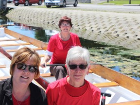 Samantha Reed/The Intelligencer
From left: Jennifer Loner, training and education co-ordinator at Three Oaks sits beside member of the dragon boat club and fundraiser organizing committee, Mary Olsen, while fellow club and fundraiser committee member Nancy Lewis mans her own boat. The Belleville Dragon Boat Club and Three Oaks Foundation are teaming up together for a second year for the annual Dragon Boat Festival on July 9.