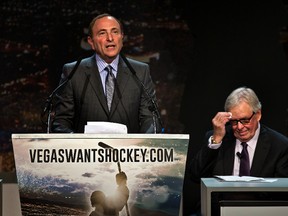 In this Feb. 10, 2015, file photo, Gary Bettman, commissioner of the National Hockey League addresses the crowd as Bill Foley, chairman, Fidelity National Financial, Inc., Black Knight and FIS wipes his forehead during the "Let's Bring Hockey to Las Vegas!" press conference at the MGM Grand Ballroom in Las Vegas. (AP Photo/The Sun, L.E. Baskow, File)
