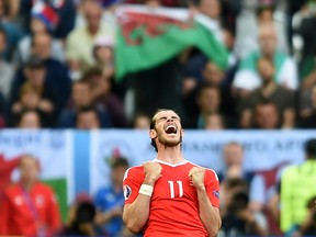 Wales forward Gareth Bale reacts as his team wins the Euro 2016 Group B match against Slovakia at the Stade de Bordeaux in Bordeaux on June 11, 2016. (AFP PHOTO/NICOLAS TUCAT)
