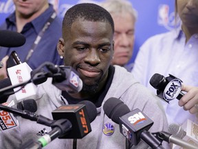 Golden State Warriors' Draymond Green answers questions before practice for Game 6 of the NBA Finals in Cleveland on June 15, 2016. (AP Photo/Tony Dejak)