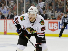 In this May 5, 2015, Chicago Blackhawks left winger Bryan Bickell gets into position for a face-off during the second period of Game 3 in the second round of the NHL playoffs against the Minnesota Wild in St. Paul, Minn. (AP Photo/Ann Heisenfelt, File)