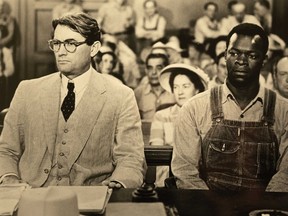 Actor Gregory Peck (L) appears with actor Brock Peters in a scene from the 1962 film "To Kill a Mockingbird."