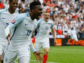 England's Daniel Sturridge (front) celebrates after scoring his side’s second goal during the Euro 2016 Group B soccer match between England and Wales at the Bollaert stadium in Lens, France, on Thursday, June 16, 2016. Behind are Marcus Rashford (left) and Jamie Vardy. (Kirsty Wigglesworth/AP Photo)