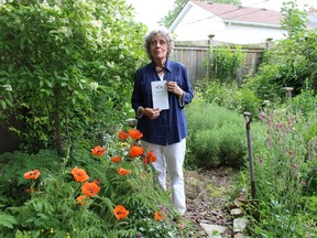 Barb Toye, coordinator of the Communities in Bloom garden tour, is pictured here in her backyard in the city's south end. Nine city backyards are on this year's tour set for June 25, with local artists lined up to paint the gardens on location this year. (Barbara Simpson/Sarnia Observer)