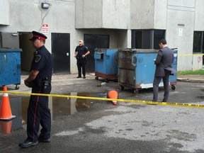 London police investigated after the body of a dead baby was found in a dumpster at Mill and Richmond streets on June 14, 2016. (DALE CARRUTHERS, The London Free Press)