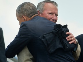 President Barack Obama and Orlando, Fla. Mayor Buddy Dyer embrace on the tarmac upon Obama's arrival on Air Force One at Orlando International Airport, Thursday, June 16, 2016, in Orlando, Fla. Obama is in Orlando today to pay respects to the victims of the Pulse nightclub shooting and meet with families of victims of the attack. (AP Photo/Pablo Martinez Monsivais)