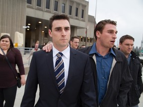 Jared Dejong (wearing tie) leaves the courthouse in London, Ont. on Thursday April 28, 2016.  Derek Ruttan/The London Free Press/Postmedia Network