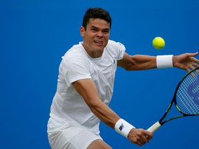 Canada’s Milos Raonic returns a shot to the Czech Republic’s Jiri Vesely during the Championships at The Queen’s Club in London, Thursday June 16, 2016. (Steve Paston/PA via AP)