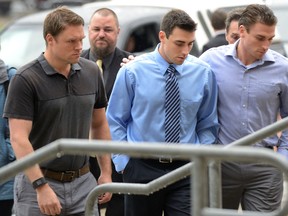 Jared Dejong, centre, arrives at the London courthouse Thursday where he was sentenced to five years in jail and a 10-year driving ban. (MORRIS LAMONT, The London Free Press)