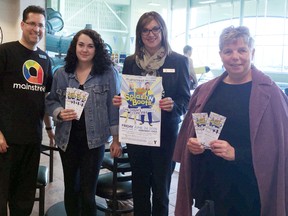 Goderich Mainstreet Credit Union branch manager James Lounsbury and staff member Laura Frayne surprise YMCA families at June 8 swim class with free tickets to the June 24 Splash’N Boots charity concert. (Contributed photo)