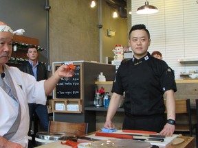 Hidekazu Tojo (left) demonstrates a sushi dish that will be taught to Vancouverites through classes at Sushi and the City.
Brian Horstead, for 24 hours