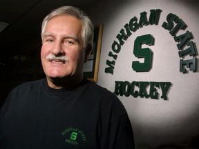 A March 7, 2001, file photo shows original Peterborough Petes player Ron Mason posed in East Lansing, Mich. Mason, who led Michigan State University to a national title in hockey and won 924 games, has died. He was 76. Spartans assistant coach Tom Newton, surrounded by Mason's family Monday morning, June 13, 2016, says Mason's death on Sunday night was "sudden." Al Goldis/The Associated Press file photo